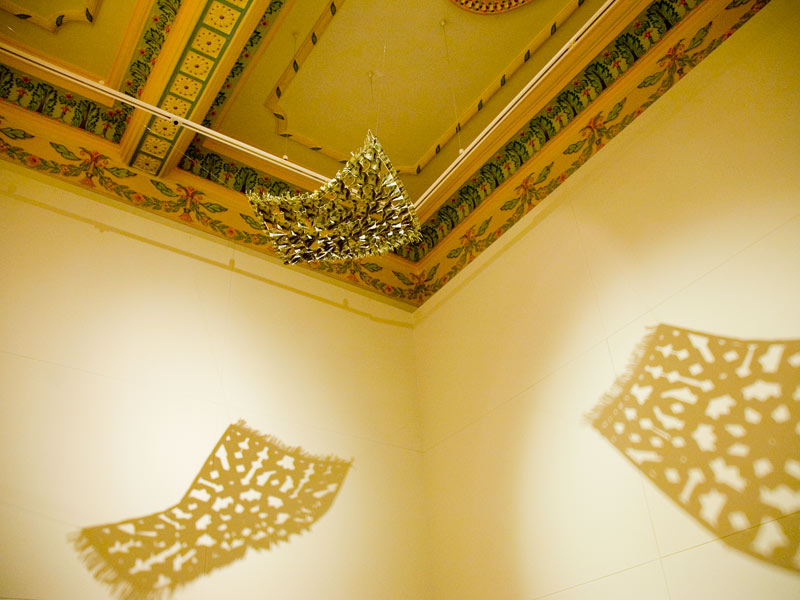 ?The Flying Rug IV?, dollar bills and staple pins by Abdullah Syed.