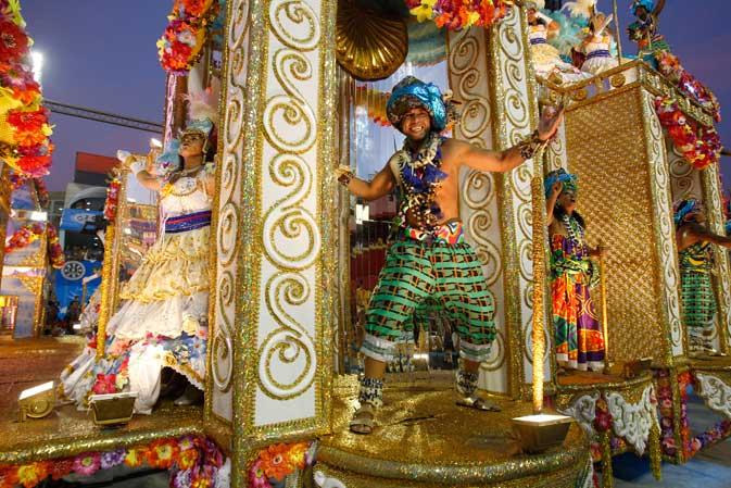 Performers from the Unidos da Vila Isabel samba school parade during carnival celebrations at the Sambadrome in Rio de Janeiro, Brazil, Monday, Feb.20, 2012. Millions watched the sequin-clad samba dancers at Rio de Janeiro's iconic Carnival parade. ?AP Photo