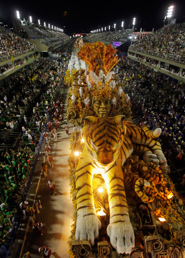 Revellers from the Porto da Pedra samba school parade on the first night of the annual Carnival parade in Rio de Janeiro's Sambadrome February 20, 2012. ? Reuters Photo
