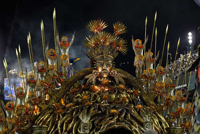 Performers from the Beija Flor samba school parade during carnival celebrations at the Sambadrome in Rio de Janeiro, Brazil, Monday, Feb. 20, 2012. Millions watched the sequin-clad samba dancers at Rio de Janeiro's iconic Carnival parade. ?AP Photo
