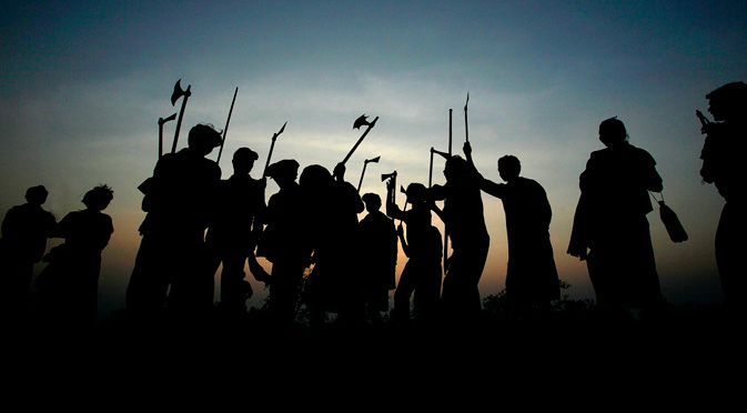Indian Dongaria Kondh tribals dance as they hold traditional tools and weapons during the annual festival of Niyam Raja in Lanjigarh at the sacred Niyamgiri Hill, about 400 kilometers (249 miles) from the eastern Indian city of Bhubaneswar, Orissa, India. In August 2010 India refused permission to London-based Vedanta Resources to mine bauxite for its alumina refinery in the Niyamgiri Hills citing violations of environmental and human rights laws. The courts are expected to hear the company's appeal later this year