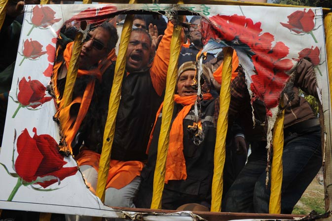 Activists of the right-wing Hindu organisation the Shiv Sena pose in front of a burning placard during a demonstration denouncing Valentine's Day in Amritsar. The Shiv Sena strongly oppose Valentine's Day celebrations citing them as a cultural invasion on the Hindu way of life. – AFP Photo.