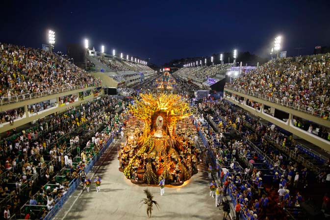 Dancers of Vila Isabel samba school, parade on a float during carnival celebrations at the Sambadrome in Rio de Janeiro, Brazil, Monday Feb. 20, 2012. Millions watched the sequin-clad samba dancers at Rio de Janeiro's iconic Carnival parade.?AP Photo