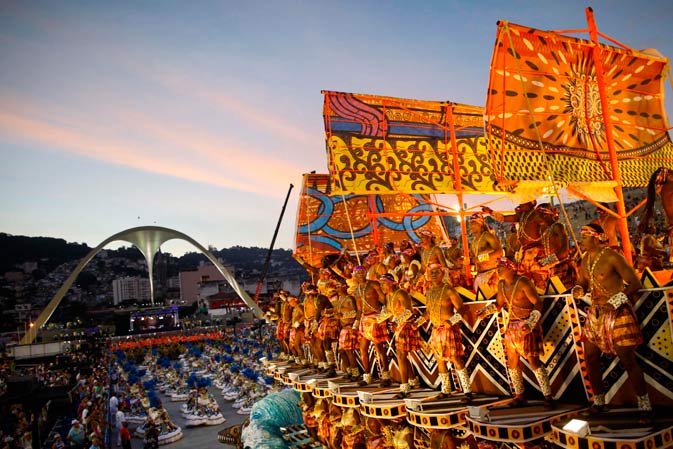 Dancers of Vila Isabel samba school parade on a float during carnival celebrations at the Sambadrome in Rio de Janeiro, Brazil, Monday Feb. 20, 2012. Millions watched the sequin-clad samba dancers at Rio de Janeiro's iconic Carnival parade. ?AP Photo
