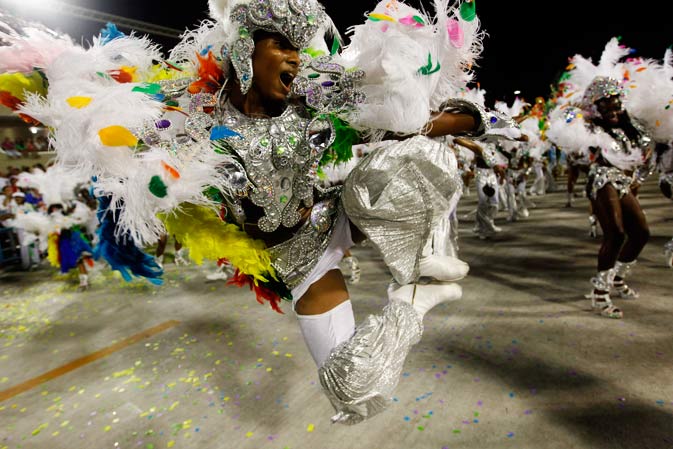 Performers from the Mocidade Independente de Padre Miguel samba school parade during carnival celebrations at the Sambadrome in Rio de Janeiro, Brazil, Monday, Feb.20, 2012. ?AP Photo