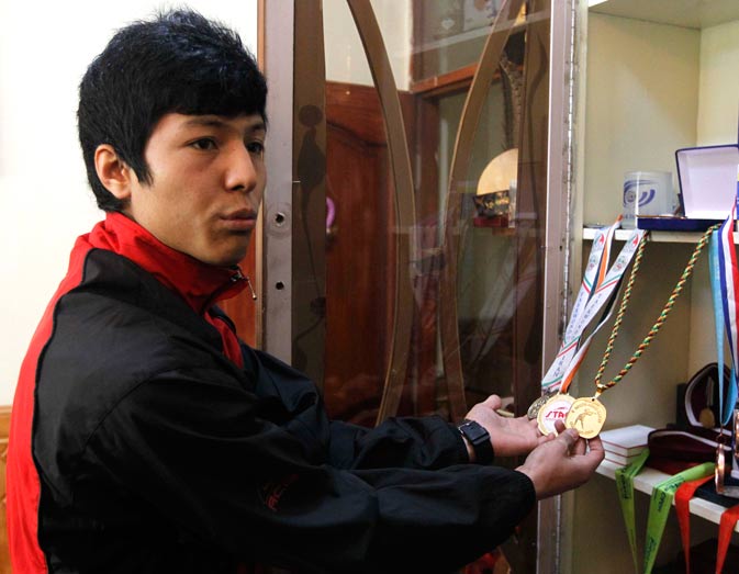 ?We can?t really compare ourselves to the world,? said Nikpai, who was lured to taekwondo after watching hours of action films as a refugee in Iran. He returned to Kabul in 2004. Nikpai received a hero's welcome upon his return from Beijing and was summoned to meet Afghan President Hamid Karzai, who presented him with a brand new flat, money and a car.