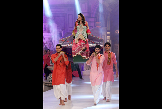 In this Saturday, April 14, 2012 photo, Pakistani models present creations by designer Ruby Shekel, during Bridal Couture Week in Karachi, Pakistan. ? Photo by AP