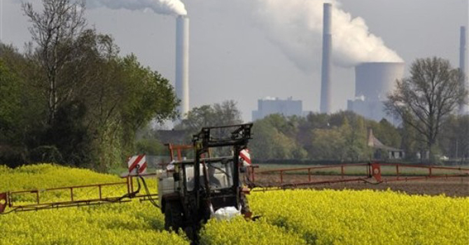A-farmer-fertilizes-rapeseed-plants670 A farmer fertilizes rapeseed plants.—AP Photo