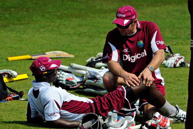 West Indies' Darren Sammy, left, is treated during a net practice session at the Trent Bridge cricket ground. ? Photo by AP