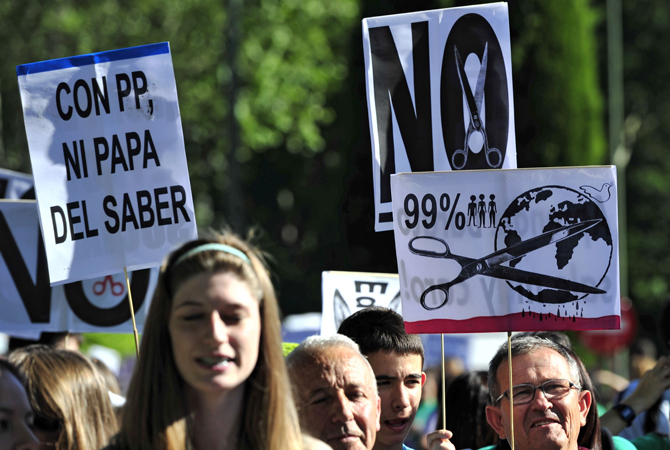 People take part in a demonstration during an education general strike in Madrid. ? Photo by AFP