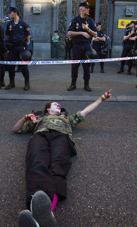A demonstrator dressed as a clown stages a performance in front of the Spanish Education Ministry during a general students and teachers' strike against educational cuts imposed by the Spanish government, in central Madrid. ? Photo by Reuters