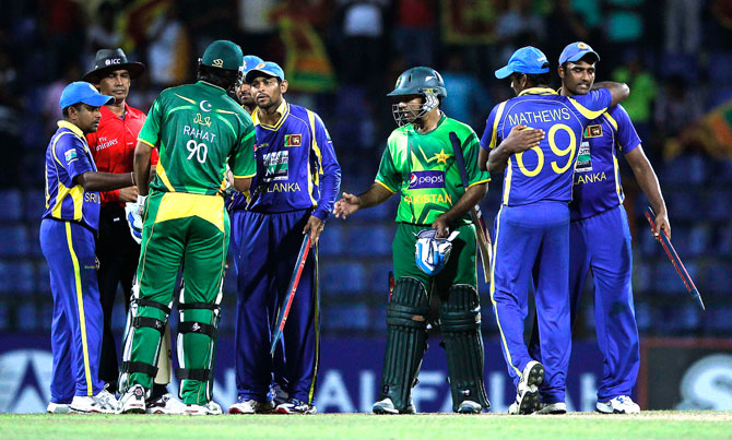 Pakistani and Sri Lankan players shake hands at the end of the second ODI. The next match will be played on Wednesday in Colombo. ? Photo by Reuters