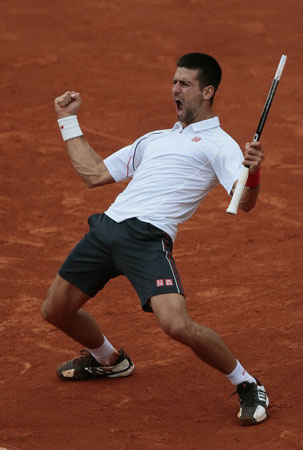 Serbia's Novak Djokovic celebrates after winning against France's Jo-Wilfried Tsonga their Men's Singles Quaterfinals. ? Photo by AFP