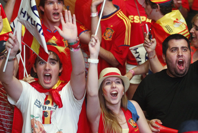 Supporters celebrate Spain's victory after their Euro 2012 quarter-final soccer match against France at a fan mile in Madrid. ? Photo by Reuters