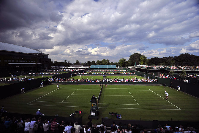 View of Court 8 during the first round women's singles match between Romania's Edina Gallovits-Hall and Spain's Silvia Soler-Espinosa on the first day of the 2012 Wimbledon Championships tennis tournament at the All England Tennis Club in Wimbledon, southwest London, on June 25, 2012. ? AFP Photo