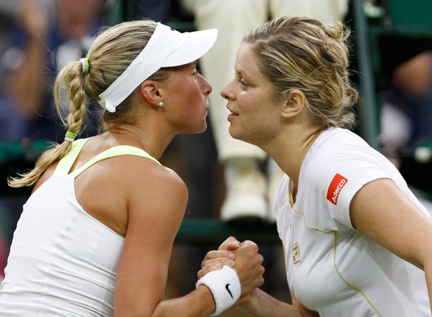 Kim Clijsters of Belgium (R) acnknowledges Andrea Hlavackova of the Czech Republic after defeating her in their women's singles tennis match. – Photo by Reuters