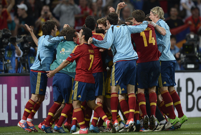 Spanish players celebrate after winning the Euro 2012 football championships semi-final match Portugal vs Spain. ? Photo by AFP