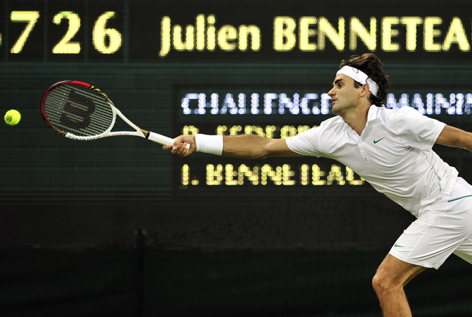 Switzerland's Roger Federer streches to reach the ball during his third round men's singles match against France's Julien Benneteau. ? Photo by AFP