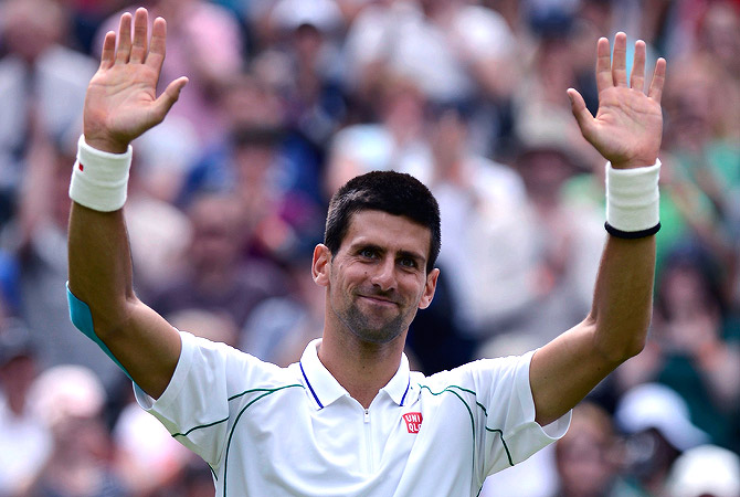 Novak Djokovic of Serbia reacts after defeating Juan Carlos Ferrero of Spain in their men's singles tennis match at the Wimbledon tennis championships in London June 25, 2012. ? Reuters Photo