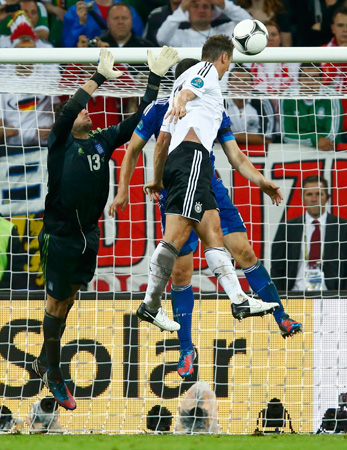Germany's Miroslav Klose (Right) scores their third goal during their Euro 2012 quarter-final soccer match against Greece.