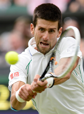 Novak Djokovic of Serbia hits a return to Radek Stepanek of the Czech Republic. ? Photo by Reuters