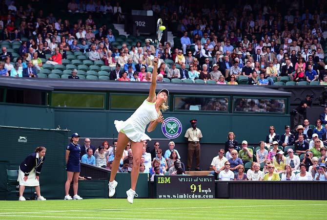 Russia's Maria Sharapova serves during her first round women's singles match against Australia's Anastasia Rodionova on the first day of the 2012 Wimbledon Championships tennis tournament at the All England Tennis Club in Wimbledon, southwest London, on June 25, 2012. ? AFP Photo
