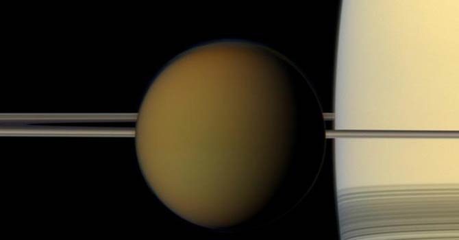 This undated true color image by the Cassini spacecraft released by Nasa shows Saturn's largest moon, Titan, passing in front of the planet and its rings. – AP This undated true color image by the Cassini spacecraft released by Nasa shows Saturn's largest moon, Titan, passing in front of the planet and its rings. – AP