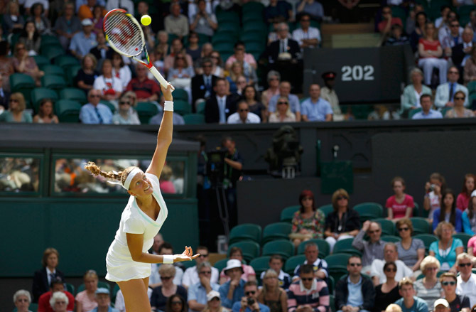 Petra Kvitova of the Czech Republic serves to Akgul Amanmuradova of Uzbekistan during their women's singles tennis match. ? Photo by Reuters