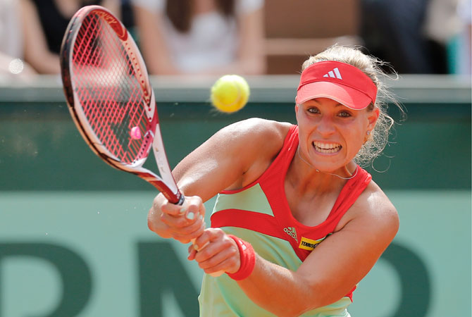 Angelique Kerber of Germany returns in her quarter final match against Sara Errani of Italy at the French. ? Photo by AP