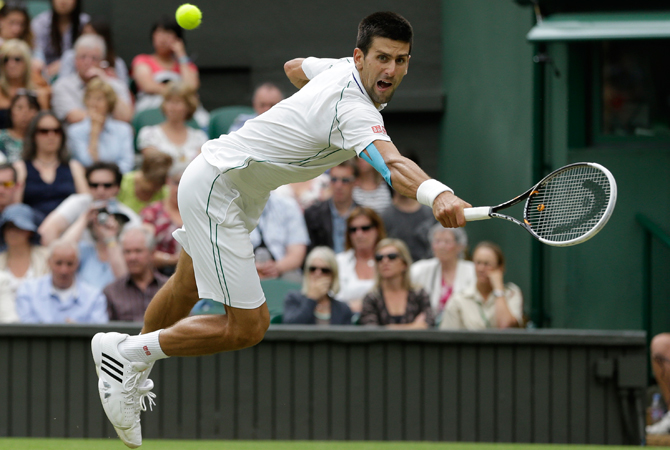Novak Djokovic of Serbia reaches for a shot by Radek Stepanek of the Czech Republic. ? Photo by AP
