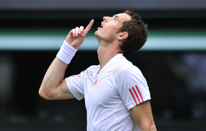 Britain's Andy Murray celebrates his first round men's singles victory over Russia's Nikolay Davydenko. ? Photo by AFP
