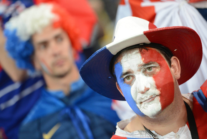A French fan reacts at the end of the Euro 2012 football championships quarter-final match Spain vs France. ? Photo by AFP