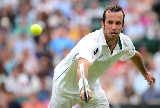 Czech Republic's Radek Stepanek plays a backhand shot during his third round men's singles match against Serbia's Novak Djokovic on day five of the 2012 Wimbledon Championships. ? Photo by AFP