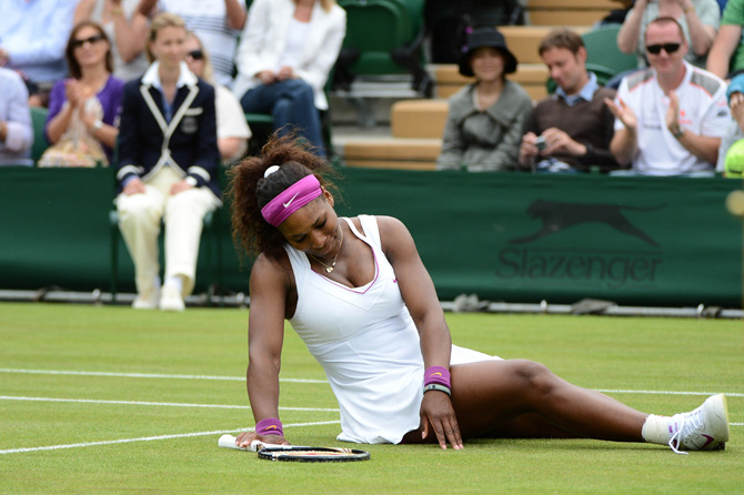 US player Serena Williams slips during her first round women's singles match against Czech Republic's Barbora Zahlavova Strycova. ? Photo by AFP