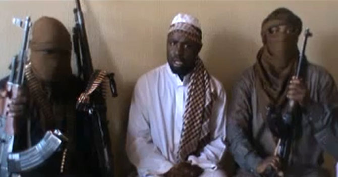 -A file screengrab taken from a video released on You Tube on April 12, 2012 apparently shows Boko Haram leader Abubakar Shekau (C) sitting flanked by militants. Boko Haram Islamists on June 18, 2012 claimed suicide attacks on three churches in northern Nigeria's Kaduna state that killed at least 16 and sparked riots that killed dozens more. AFP PHOTO / YOUTUBE == RESTRICTED TO EDITORIAL USE - MANDATORY CREDIT "AFP PHOTO / YOUTUBE" - NO MARKETING NO ADVERTISING CAMPAIGNS - DISTRIBUTED AS A SERVICE TO CLIENTS == A file screengrab taken from a video released on You Tube on April 12, 2012 apparently shows Boko Haram leader Abubakar Shekau (C) sitting flanked by militants. Boko Haram Islamists on June 18, 2012 claimed suicide attacks on three churches in northern Nigeria's Kaduna state that killed at least 16 and sparked riots that killed dozens more. AFP PHOTO / YOUTUBE == RESTRICTED TO EDITORIAL USE - MANDATORY CREDIT "AFP PHOTO / YOUTUBE" - NO MARKETING NO ADVERTISING CAMPAIGNS - DISTRIBUTED AS A SERVICE TO CLIENTS ==