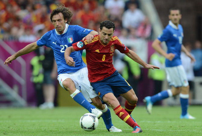 Spanish midfielder Xavi Hernandez vies with Italian midfielder Andrea Pirlo during the Euro 2012 championships football match Spain vs Italy at the Gdansk Arena.