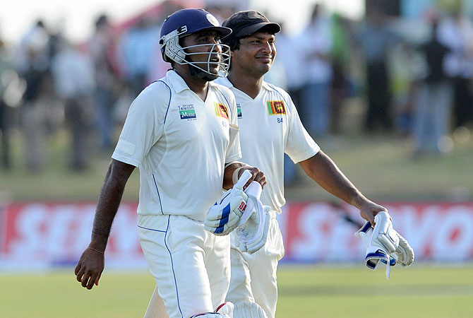 Kumar Sangakkara (R) and Mahela Jayawardene leave the ground at close of play. -Photo by AFP