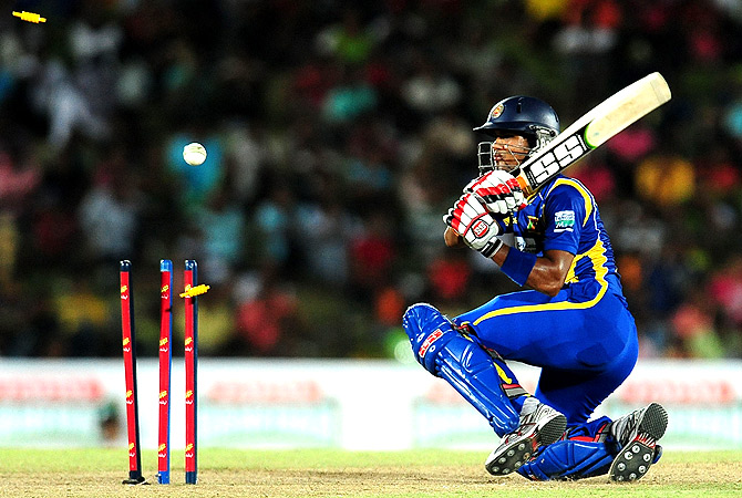 Sri Lanka's cricketer Dinesh Chandimal gets dismissed. -Photo by AFP