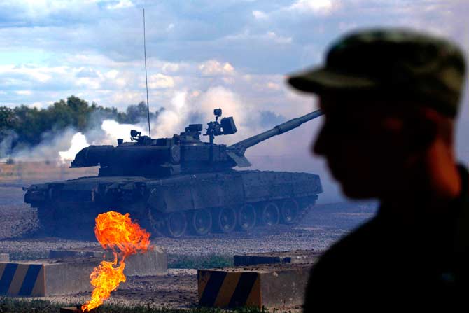A Russian T-80 tank is driven at a firing ground during a demonstration show, part of the "Engineering Technologies 2012" forum, in Zhukovsky outside Moscow. ? Photo by Reuters
