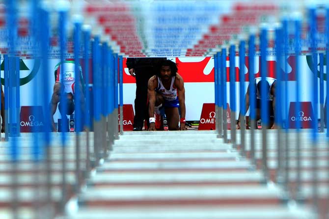 France's Samuel Coco-Viloin prerpares before the men's 110 m hurdles qualifications at the 2012 European Athletics Championships at the Olympic Stadium in Helsinki. ? Photo by AFP