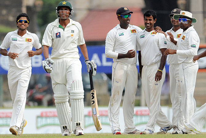 Younis wasn't convinced when he was adjudged caught behind off the bowling of Nuwan Kulasekara. -Photo by AFP