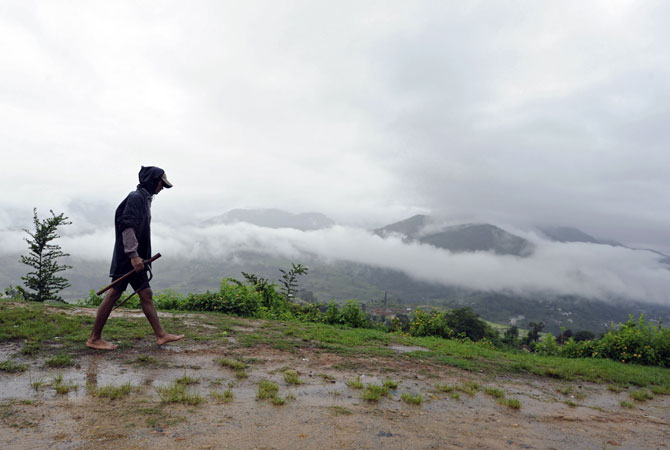 A Nepalese farmer walks home at Khokana village on the outskirts of Kathmandu. ? Photo by AFP