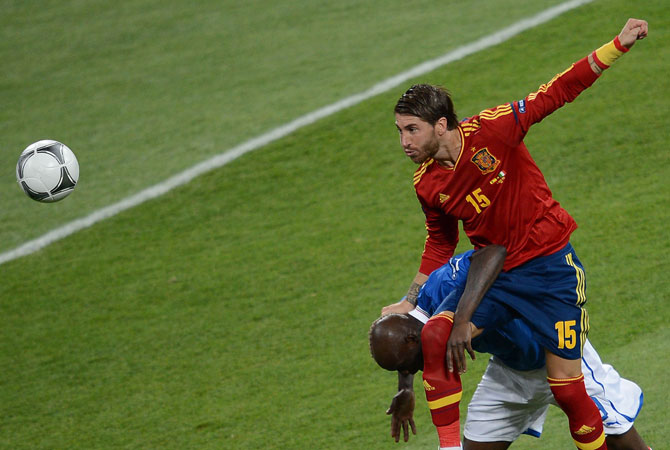Spanish defender Sergio Ramos heads the ball during the Euro 2012 football championships final. ? Photo by AFP