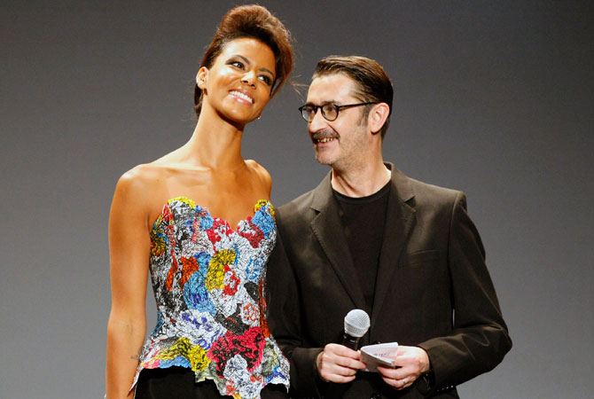 French fashion designer Frank Sorbier smiles at French singer Shy'm after the presentation of his Haute Couture Fall-Winter 2013 collection in Paris. ? Photo by AP