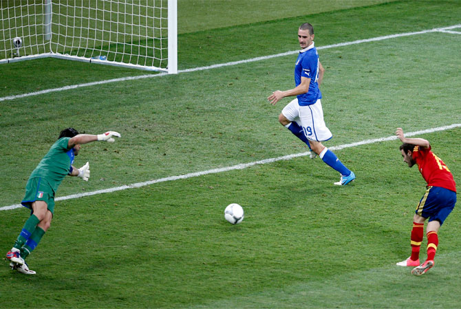 Spain's Juan Mata scores his side's fourth goal during the Euro 2012 final. ? Photo by AP