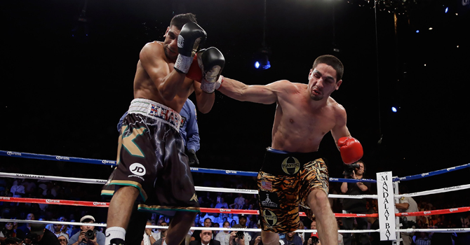 Amir Khan v Danny Garcia Danny Garcia (R) lands a right hand to the head of Amir Khan of Great Britain during their WBC/ WBA Super Lightweight and vacant Ring Magazine Junior Welterweight title fight at Mandalay Bay Events Center on July 14, 2012 in Las Vegas, Nevada.