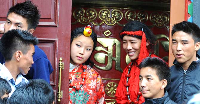 Exile Tibetans in traditional costumes wait to perform at a cultural show in Katmandu. ? Photo by AFP