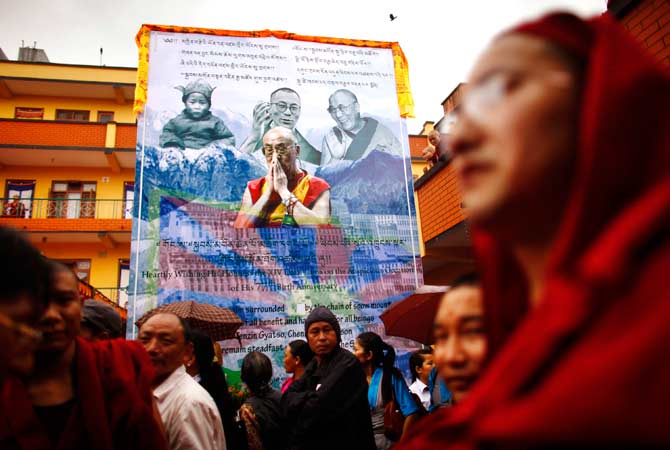 Tibetans gather to mark the birthday of their spiritual leader the Dalai Lama at a monastery. ? Photo by AP