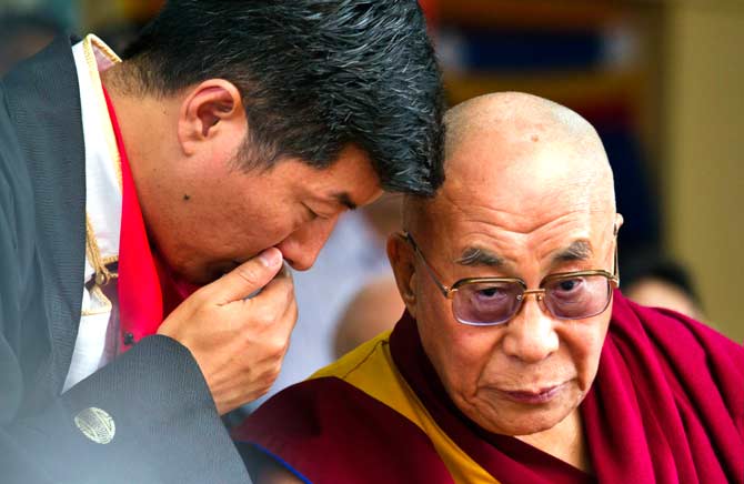 The Dalai Lama, right, listens to Lobsang Sangay, prime minister of Tibet's government in exile, during a function at the Tsuglakhang temple in Dharmsala. ? Photo by AP