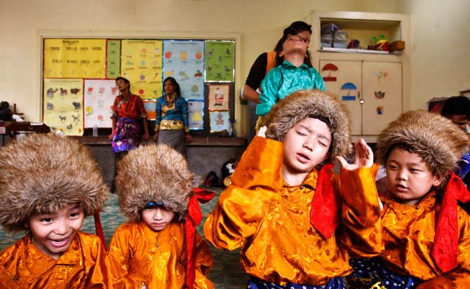 Children in traditional dress wait to perform in New Delhi. ? Photo by AP